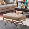 Taburete otomano tapizado de cuero beige patas doradas