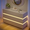 Commode LED Lumio avec 6 tiroirs et station de charge en blanc, 120 cm