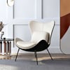 Fauteuil à oreilles rembourré en similicuir avec coussin et pieds en métal
