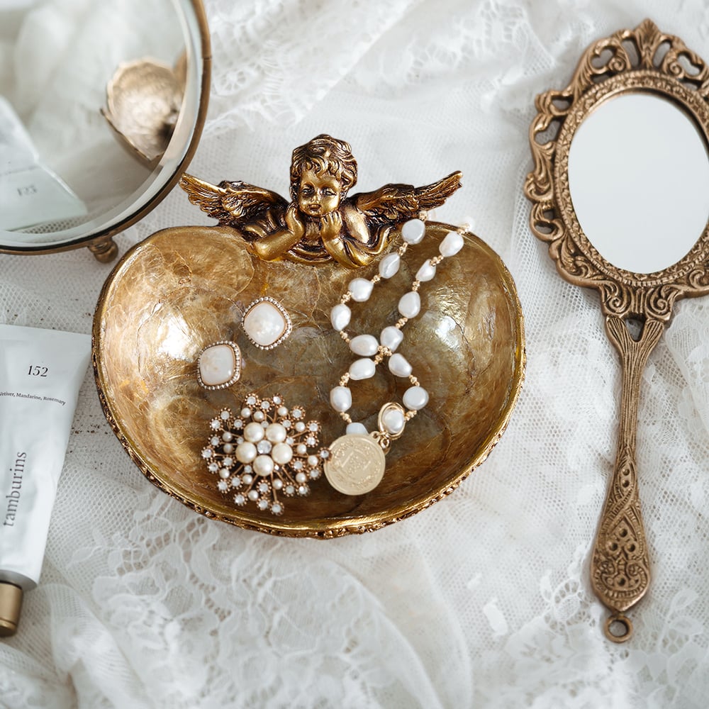 Questions et Réponses pour Plateau de rangement décoratif Shellium en forme d'ange en bronze vintage