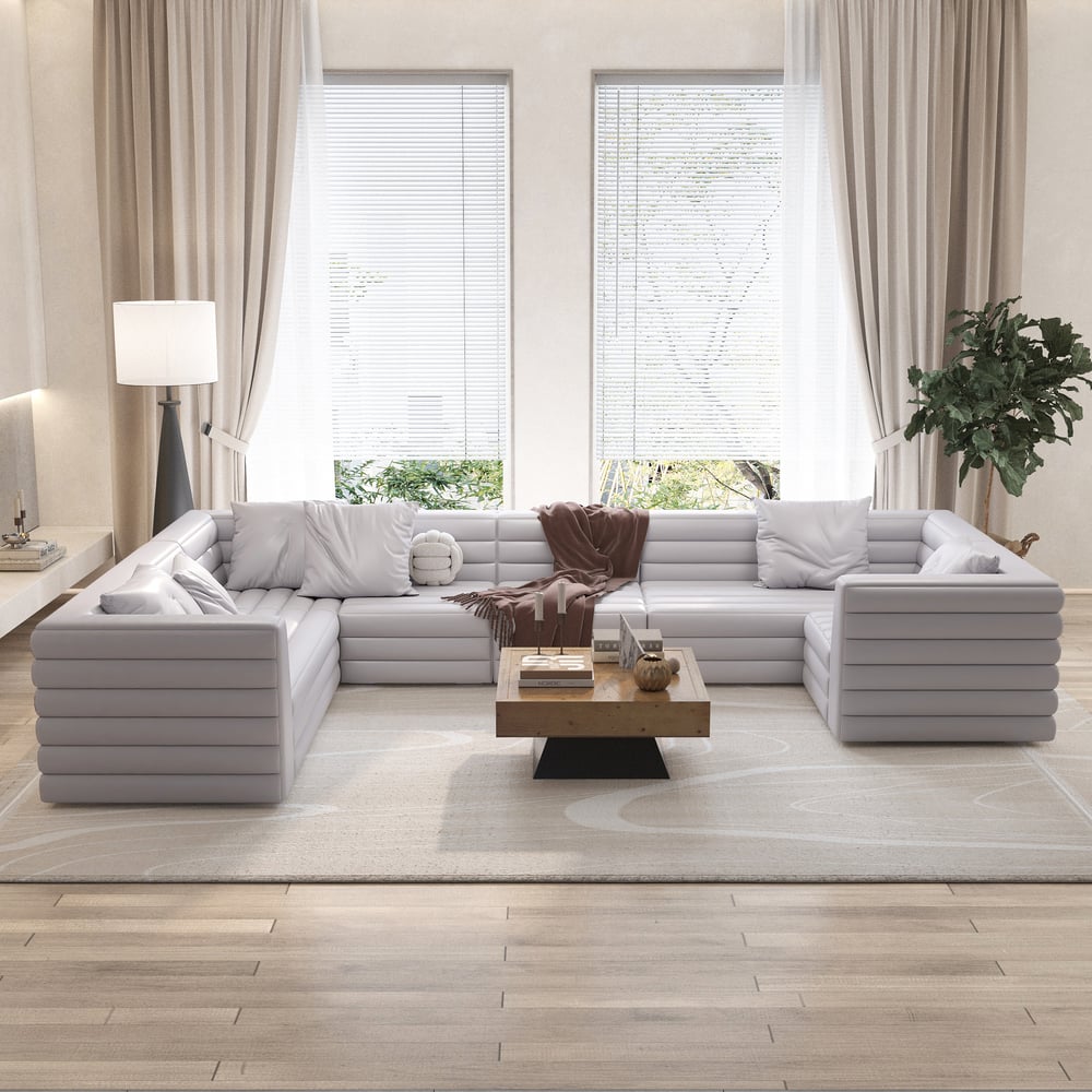 Questions et Réponses pour Canapé sectionnel modulaire moderne en cuir microfibre gris en forme de U de 3200 mm pour 8 places