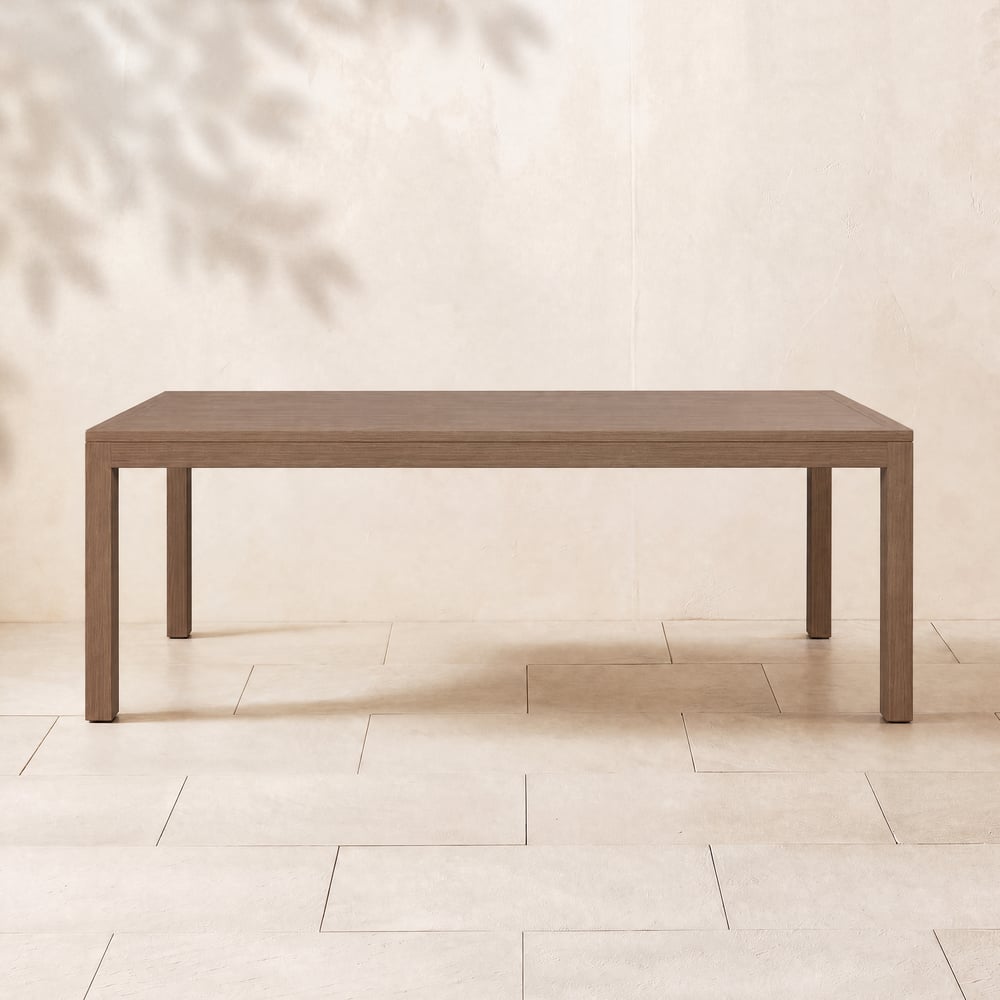 Table à manger d’extérieur Wevara 220 cm en aluminium à lattes finition noyer image de fenêtre