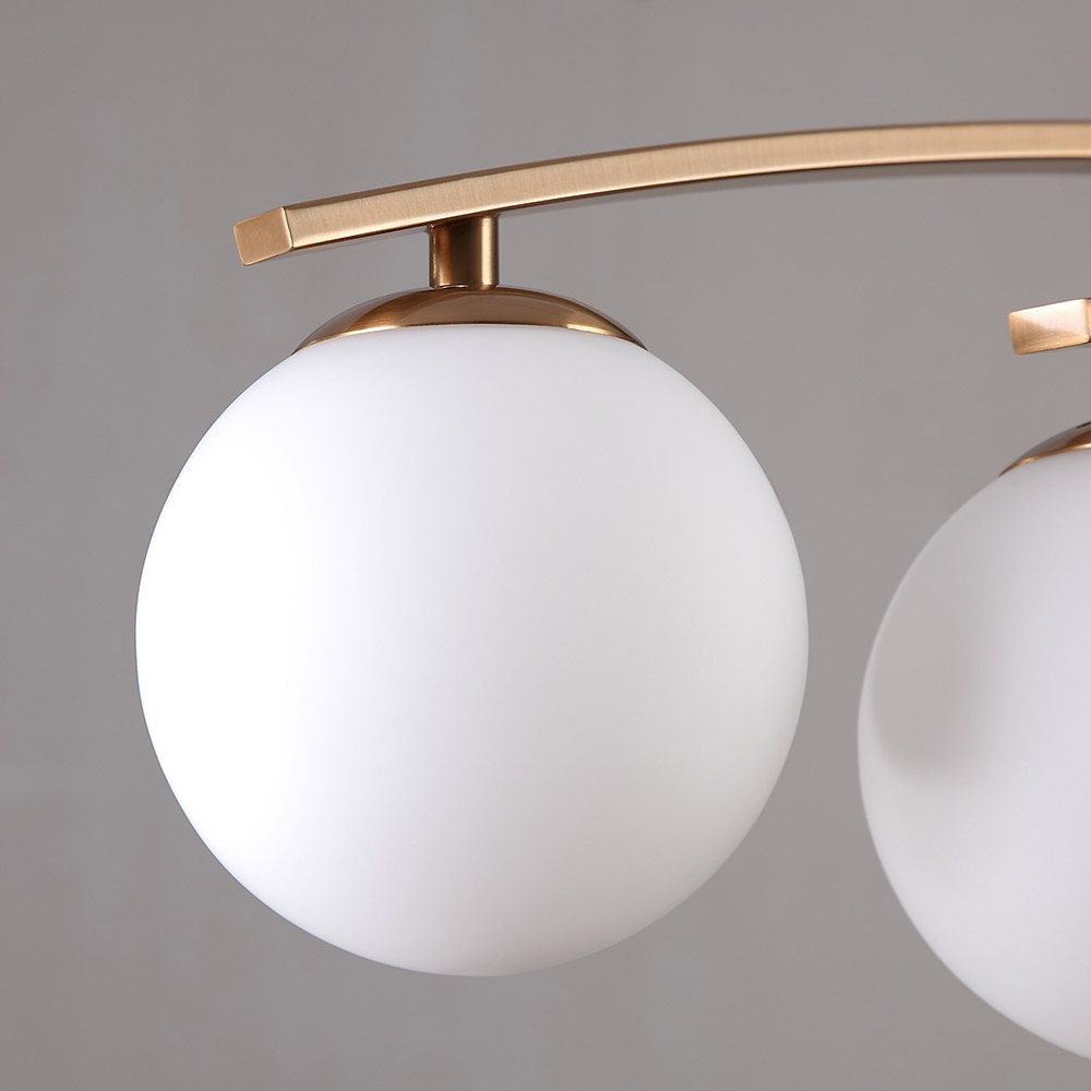 Modern 4-Light White Glass Globe Brass Metal Semi Flush Mount Ceiling Light Fixture window image