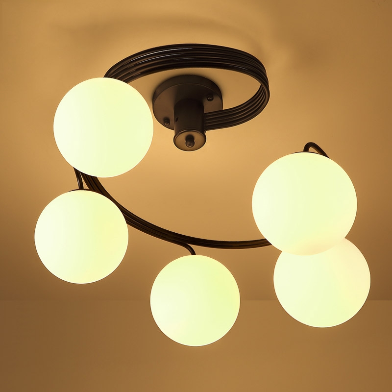 Modern Globe Glass Shade Black Metal Swirl Arm 3-Light Semi Flush Mount Ceiling Light window image