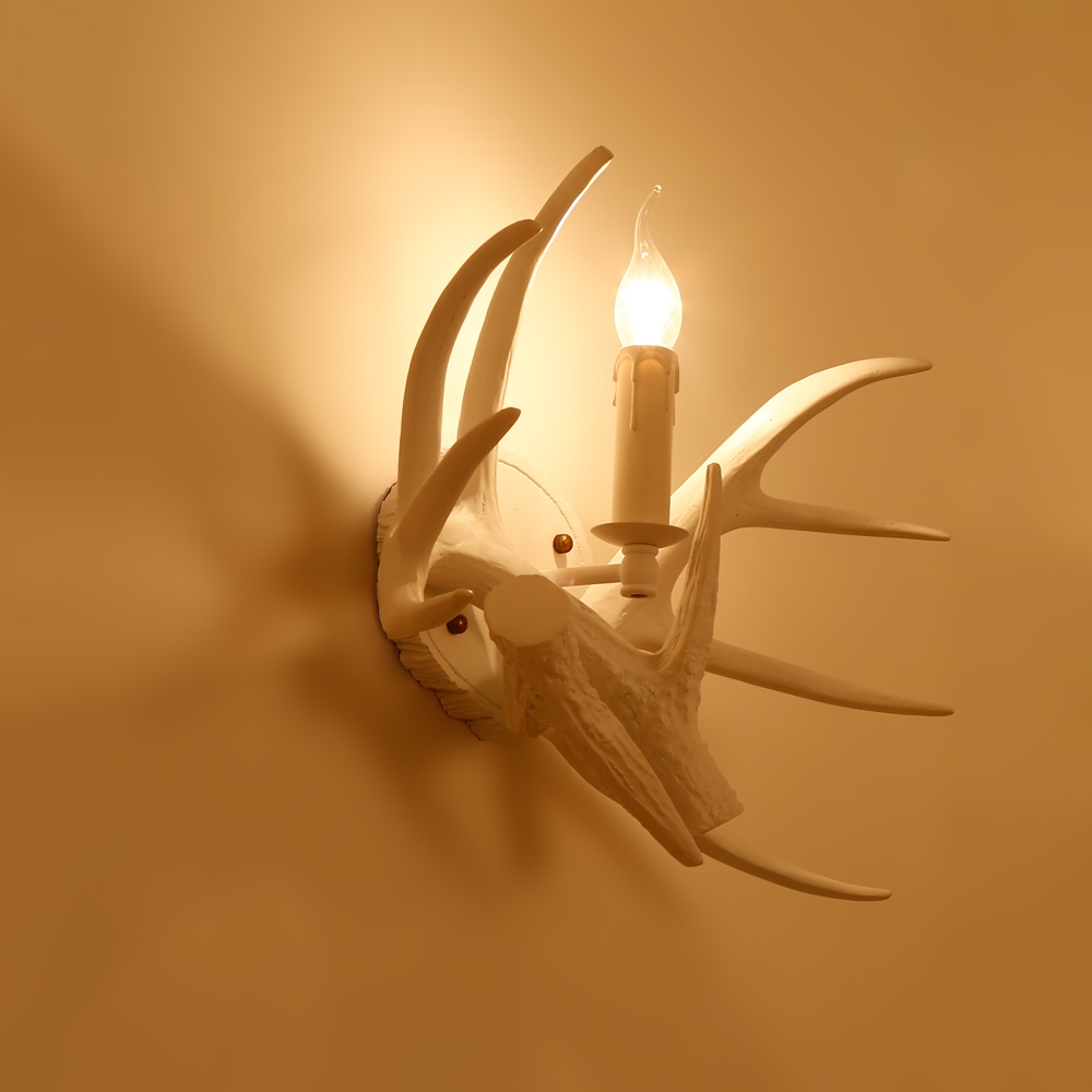 Lodge Solid White Resin Faux Deer Antler Indoor Wall Sconce with 1 Candle Light window image