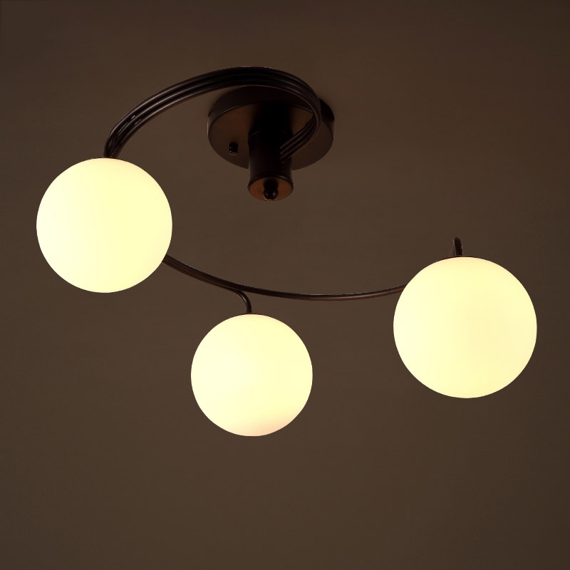 Modern Globe Glass Shade Black Metal Swirl Arm 3-Light Semi Flush Mount Ceiling Light window image