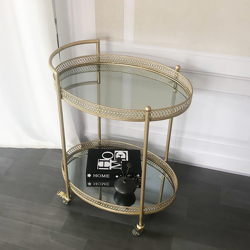 Gouden 23,6 „2-laags ovale rollende serveerbarwagen met handvat gespiegelde planken van gehard glas Vensterafbeelding