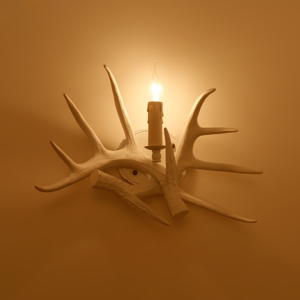 Lodge Solid White Resin Faux Deer Antler Indoor Wall Sconce with 1 Candle Light window image
