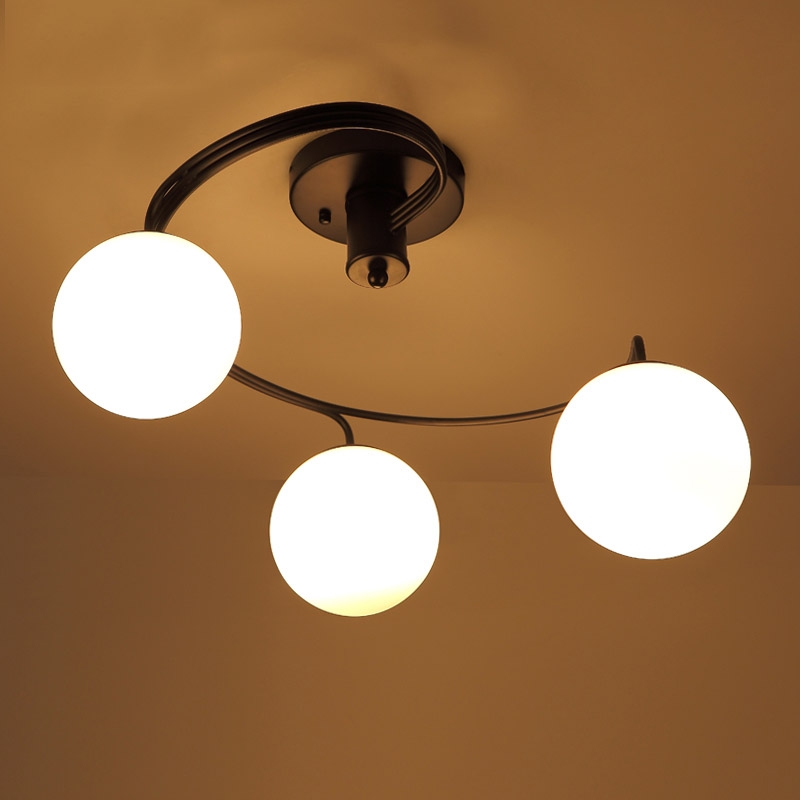 Modern Globe Glass Shade Black Metal Swirl Arm 3-Light Semi Flush Mount Ceiling Light window image