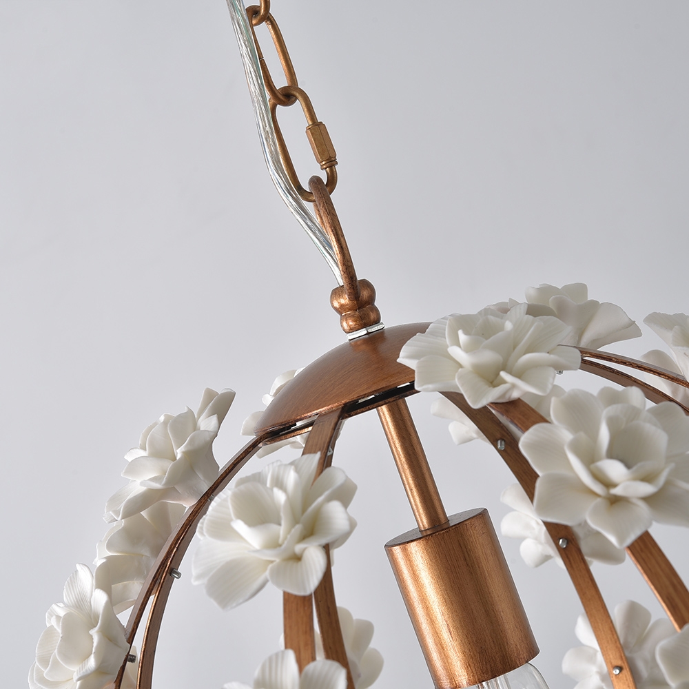 Faye Modern White Ceramic Flowers 1-Light Wrought Iron Globe Pendant Light in Gold Finish