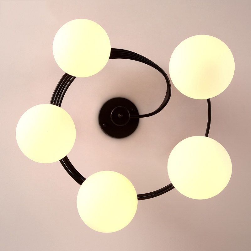 Modern Globe Glass Shade Black Metal Swirl Arm 3-Light Semi Flush Mount Ceiling Light window image