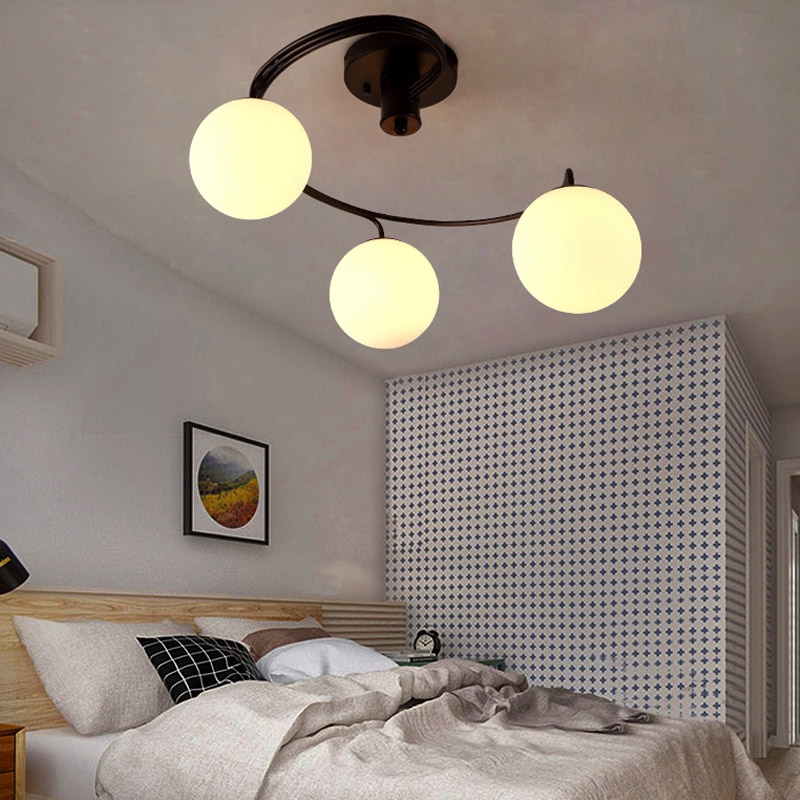 Modern Globe Glass Shade Black Metal Swirl Arm 3-Light Semi Flush Mount Ceiling Light window image