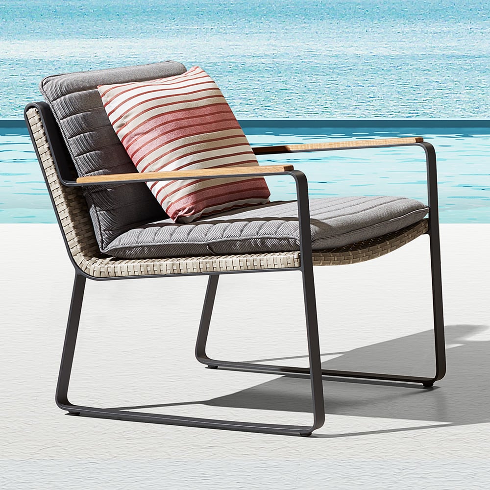 Rattan Woven Outdoor Accent Chair with Striped Cushion and Pillow window image