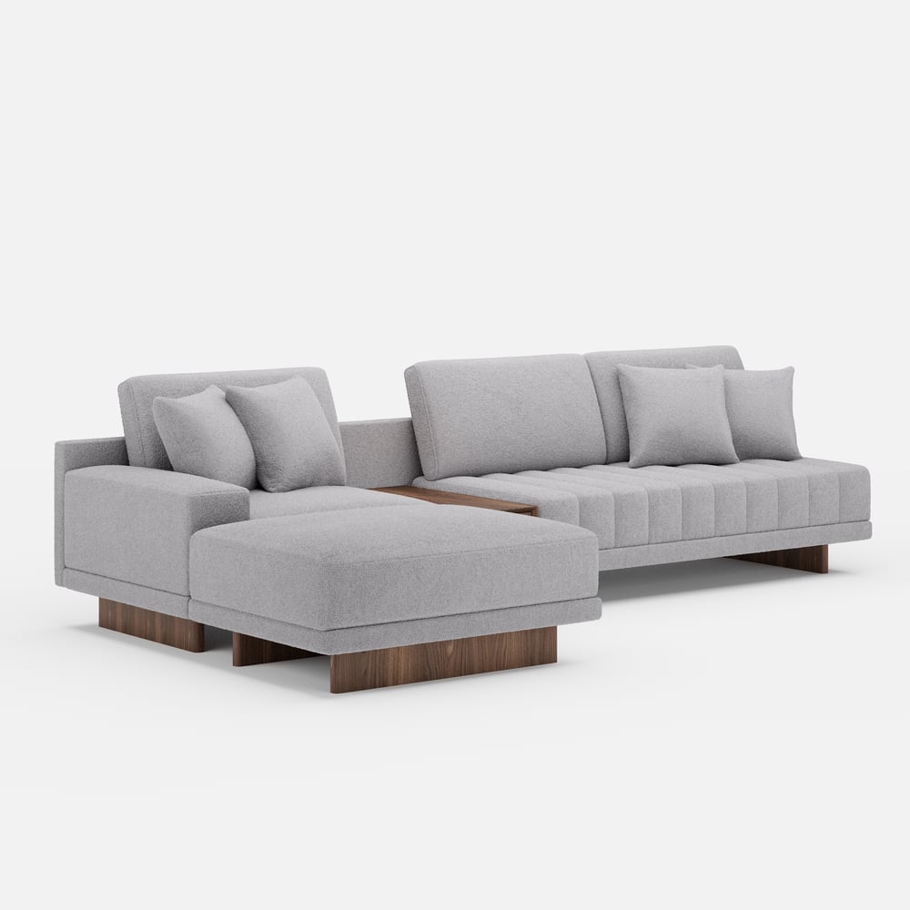 Sofá modular en forma de L Vewal de 320 cm en tela bouclé con chaise longue y otomana Imagen de ventana