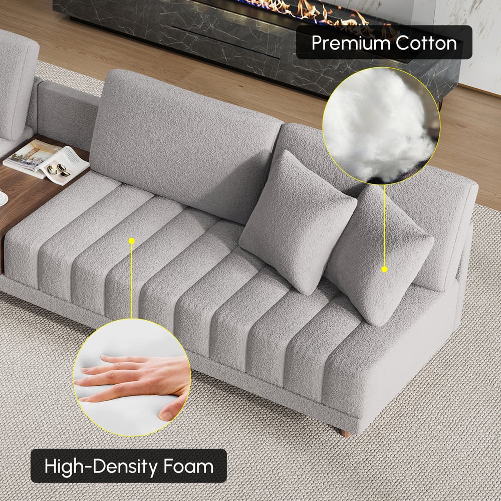 Sofá modular en forma de L Vewal de 320 cm en tela bouclé con chaise longue y otomana Imagen de ventana