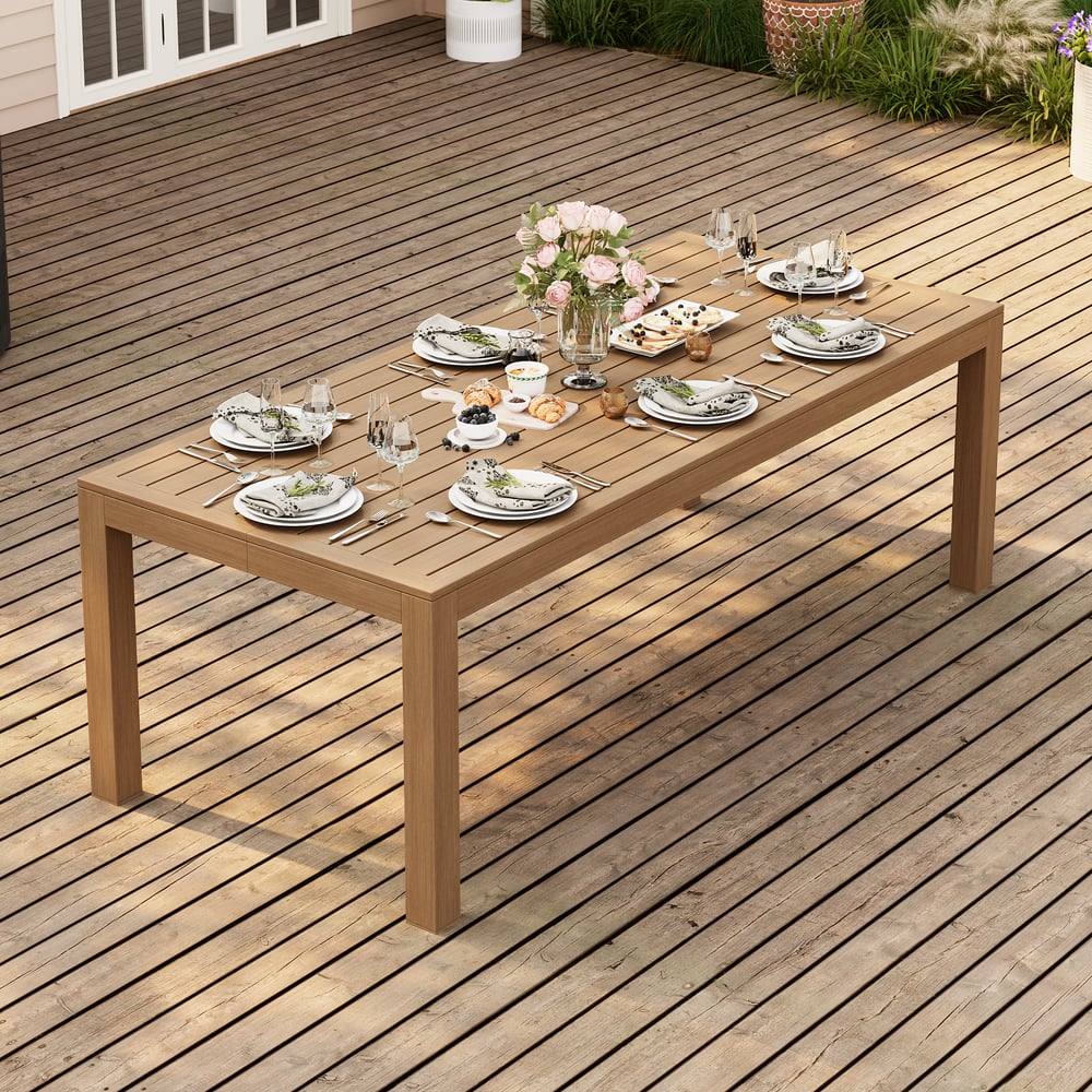 Table à manger d’extérieur Wevara 220 cm en aluminium à lattes finition noyer image de fenêtre