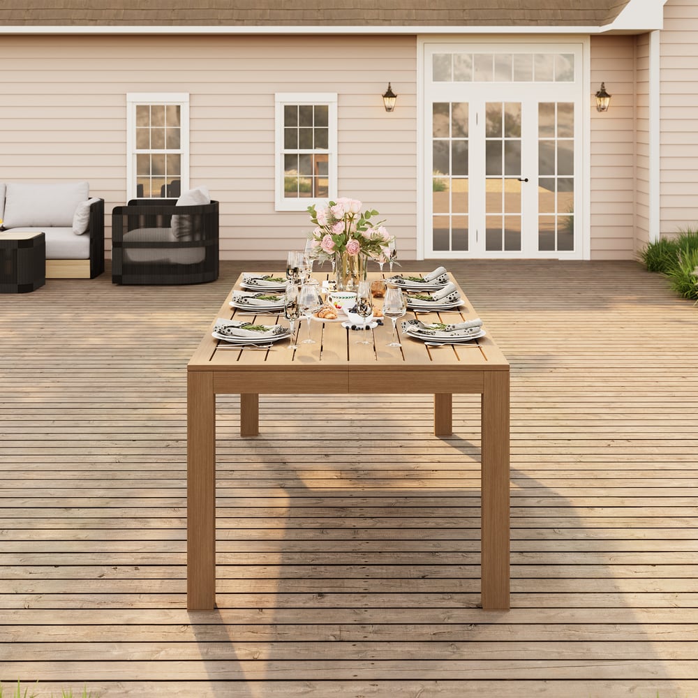 Table à manger d’extérieur Wevara 220 cm en aluminium à lattes finition noyer image de fenêtre