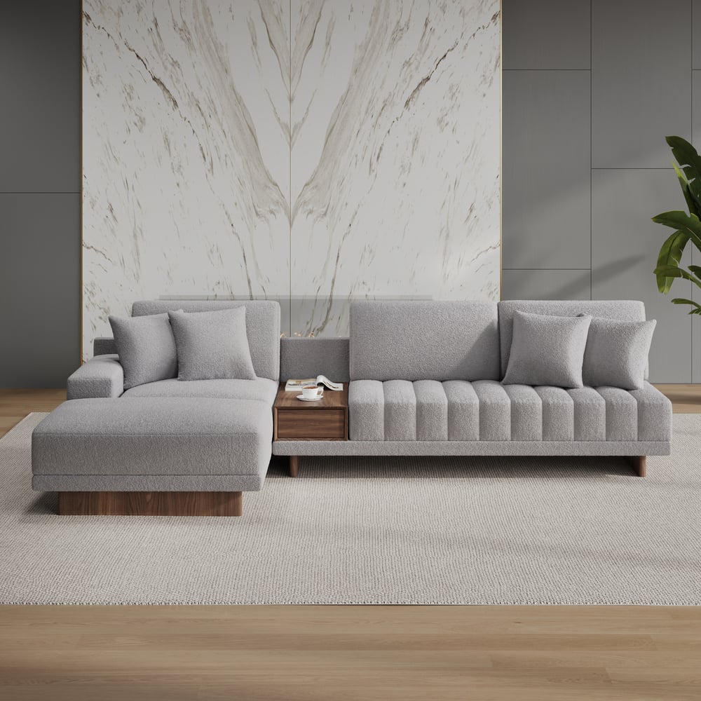 Sofá modular en forma de L Vewal de 320 cm en tela bouclé con chaise longue y otomana Imagen de ventana