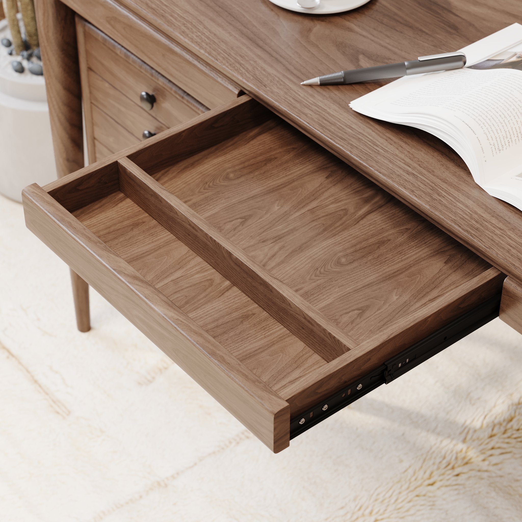 Close-up of the wooden desktop and drawer structure of a writing desk.