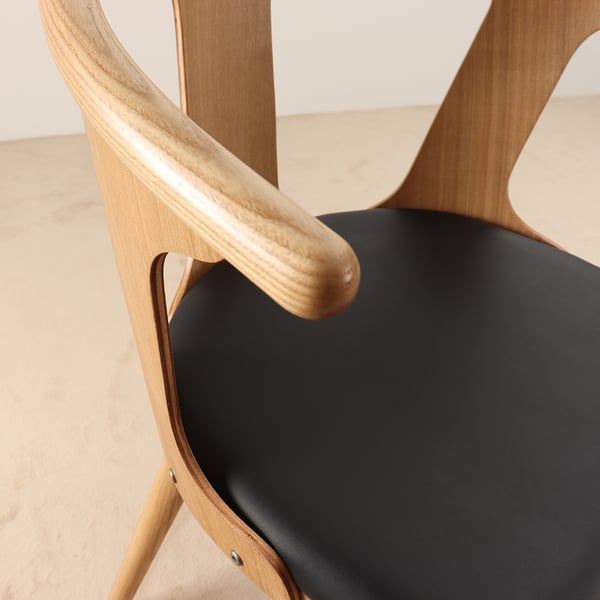 Modern Black Faux Leather Dining Chair with Curved Back Homary