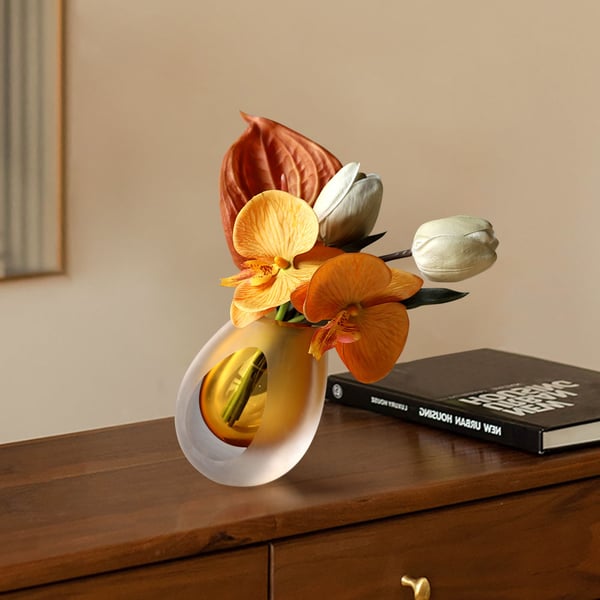 Orange Artificial Flower Arrangement in Vase Clear Glass Bottle Table