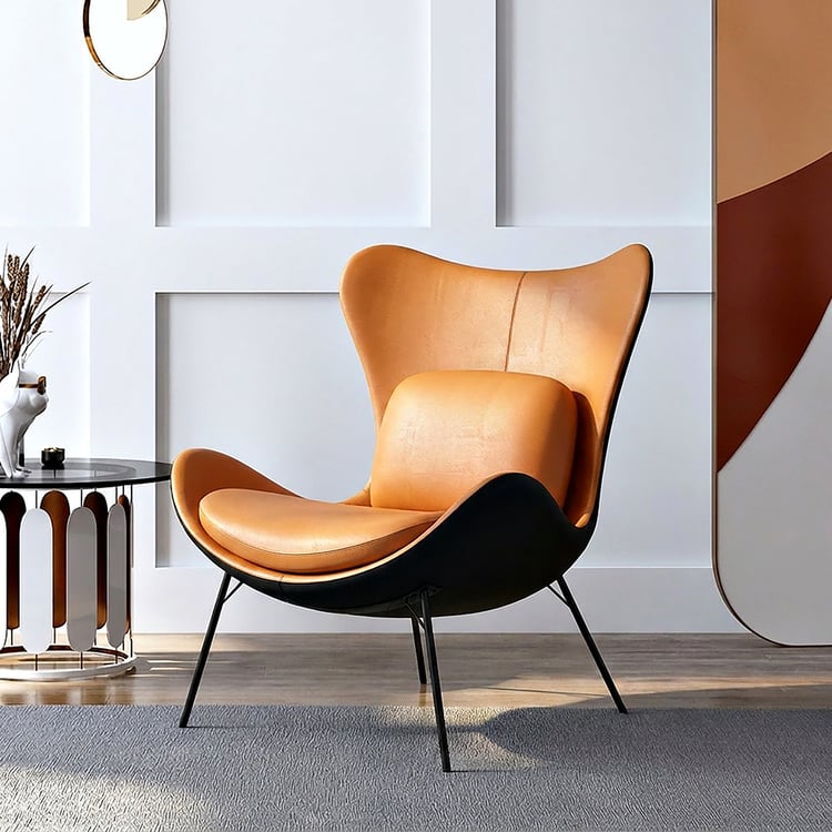 Kunstleren oorfauteuil met kussen en metalen poten