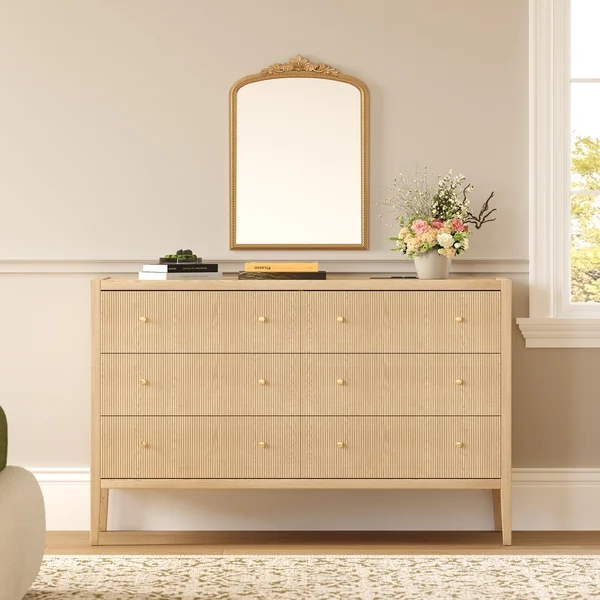 Modern fluted dresser with six drawers in a bright contemporary bedroom
