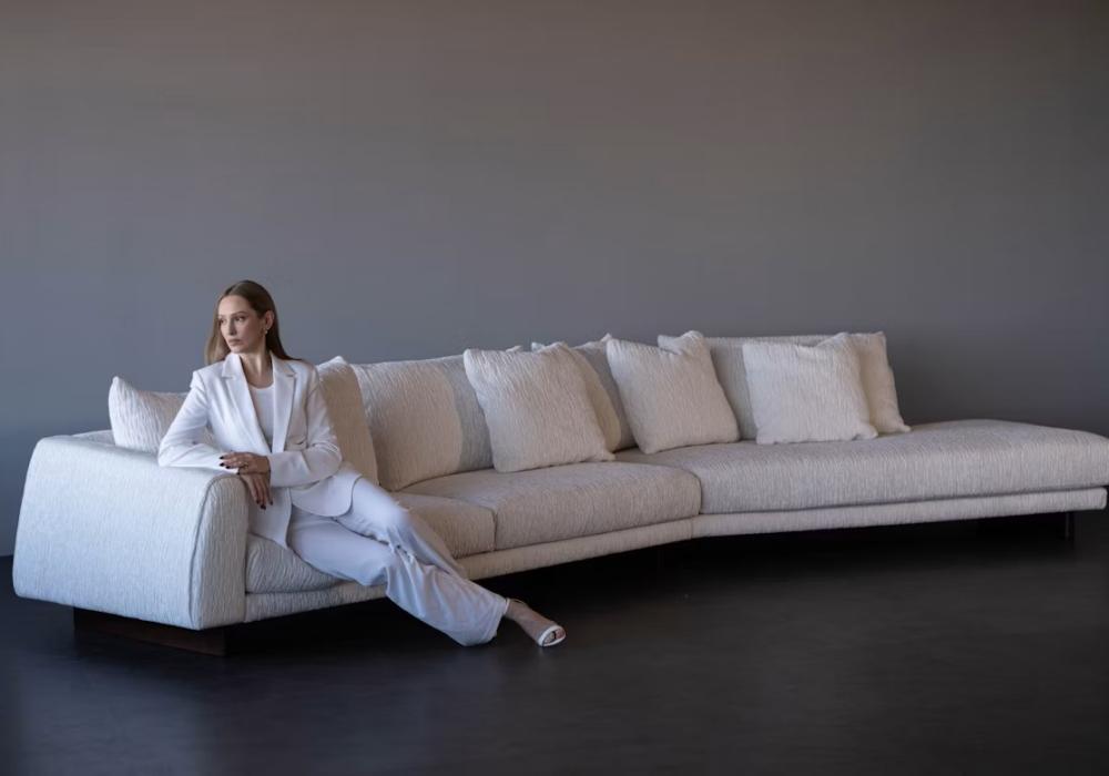 woman-in-white-suit-sitting-on-a-modern-white-sofa