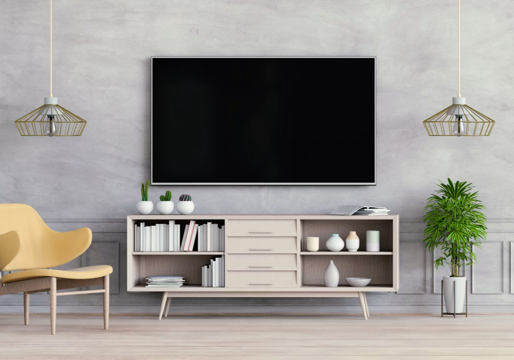 a room with a tv and shelves