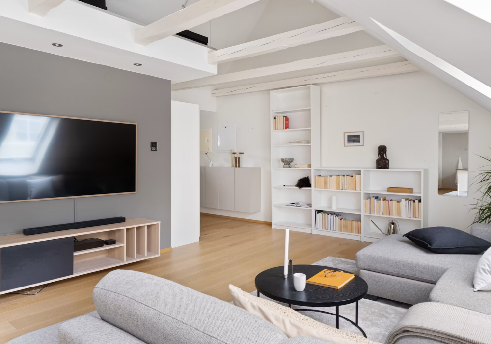 A living room filled with furniture and a flat screen TV